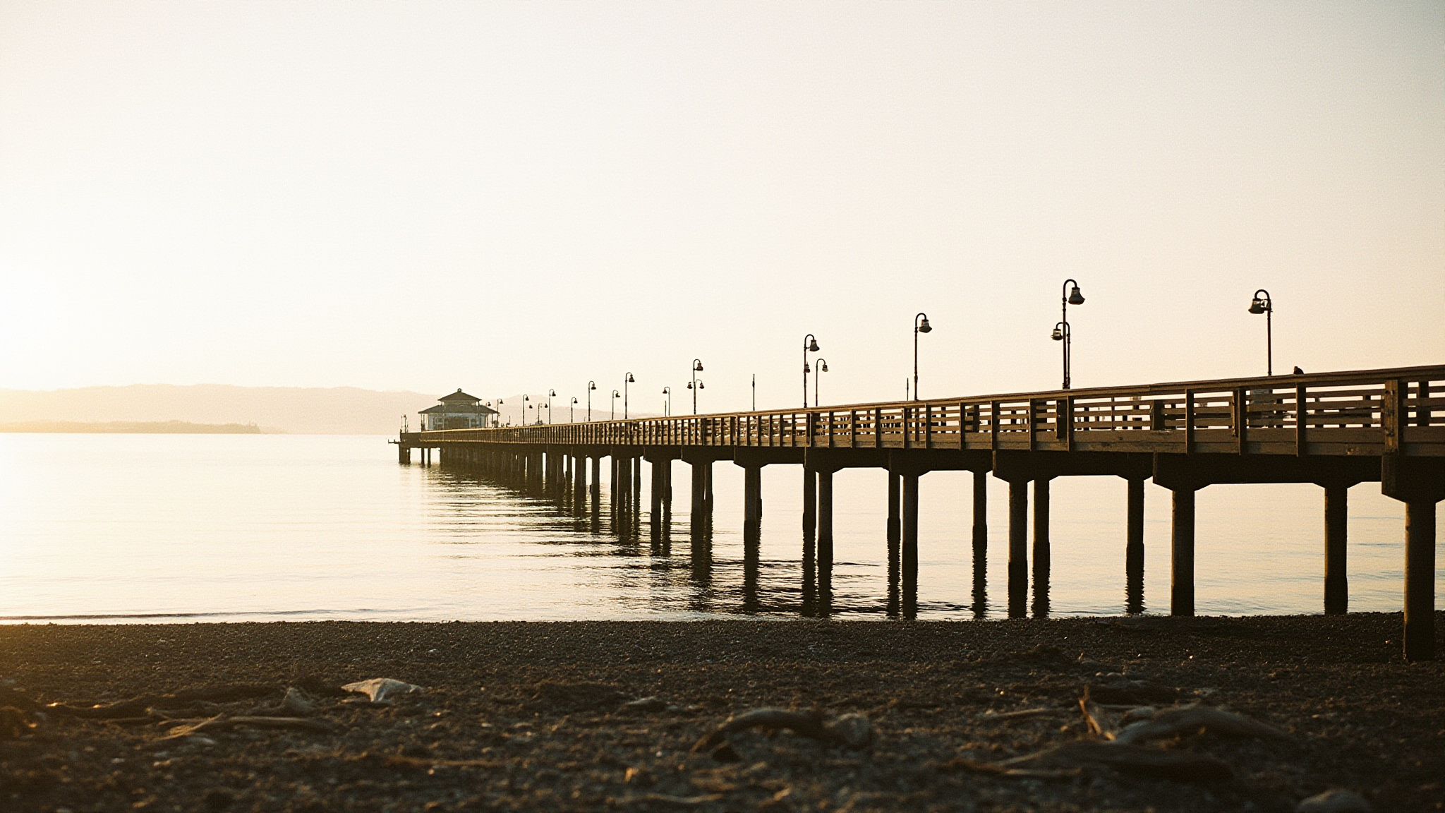 wr pier hero Everything You Need to Know About the White Rock Pier The White Rock Pier stretching over calm Semiahmoo Bay at golden hour
