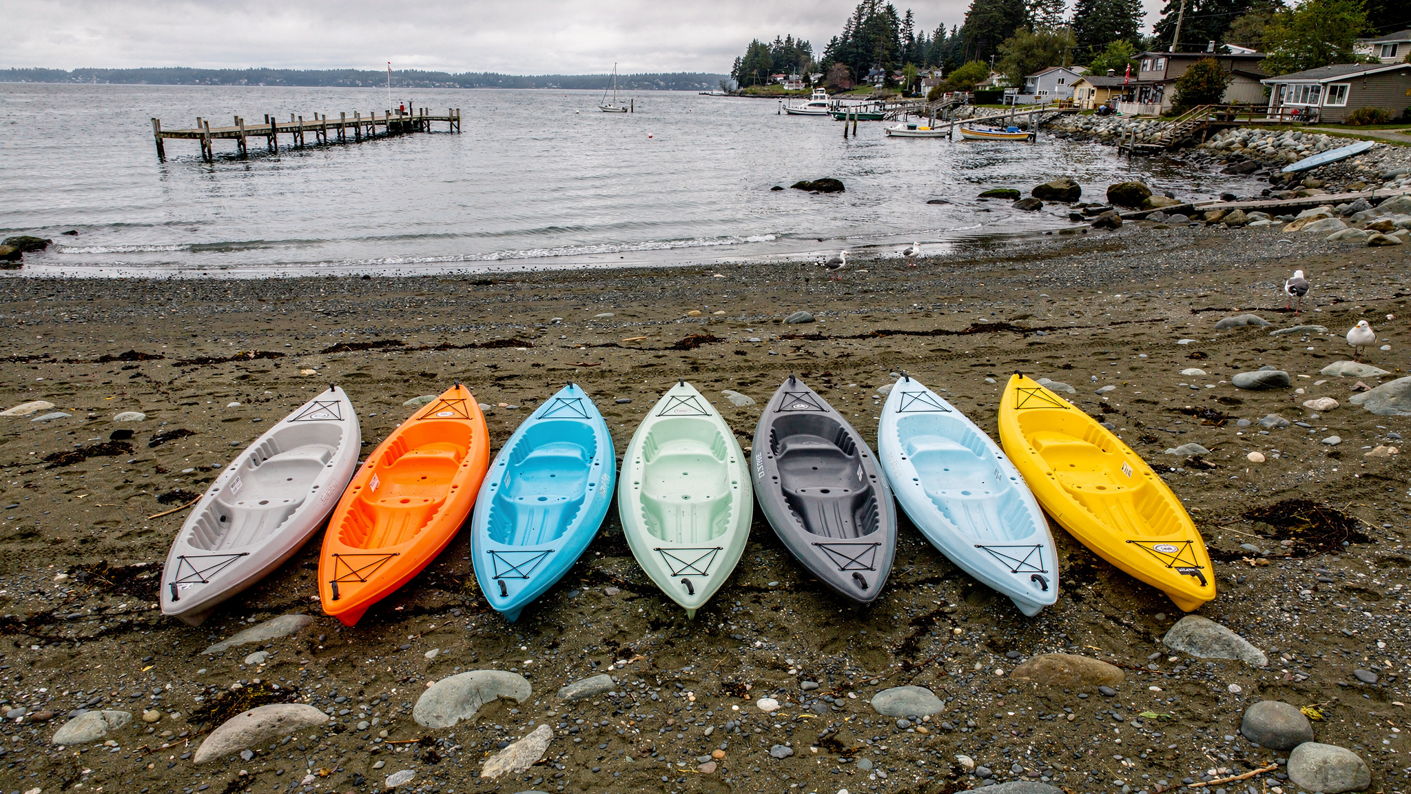 kayak beach v2 Paddleboarding and Kayaking Spots Near White Rock BC Colorful kayaks lined up on the beach near White Rock at low tide