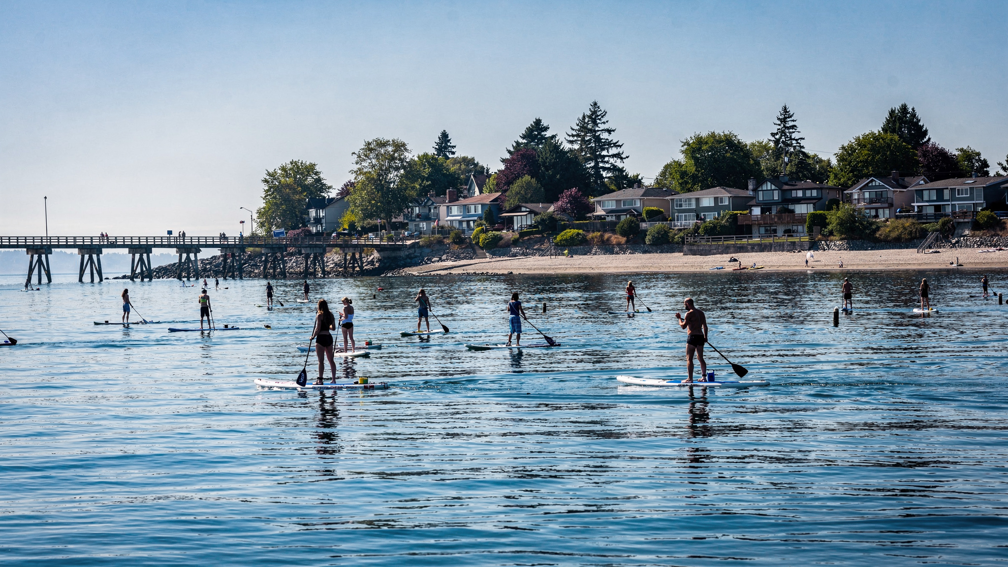 paddle water v2 Paddleboarding and Kayaking Spots Near White Rock BC Paddleboarders on the water near the White Rock pier and waterfront homes